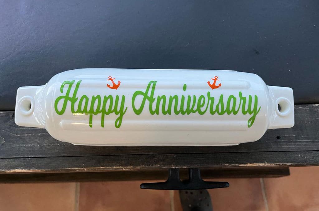 White bouy that reads: Happy Anniversary